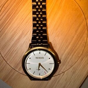 Nixon Classic Gold and White Timepiece